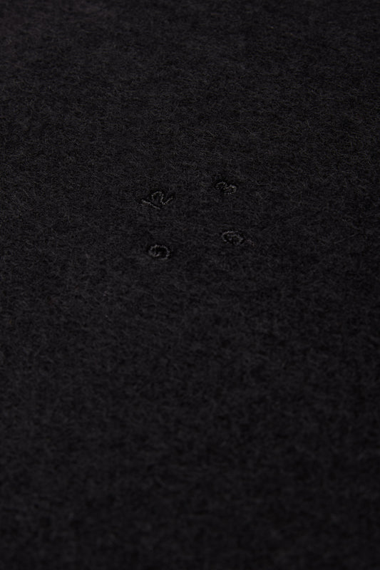 Unisex accessories cashmere scarf, black, with subtle embroidered details.
