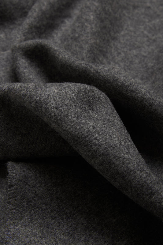 Women's accessories cashmere scarf, grey melange, soft texture, folded.
