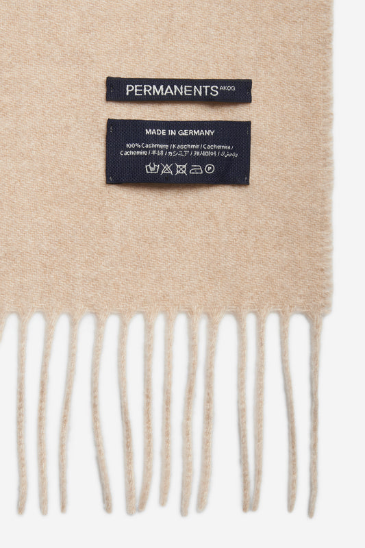 Women's accessories cashmere scarf, creme, with brand and care labels.
