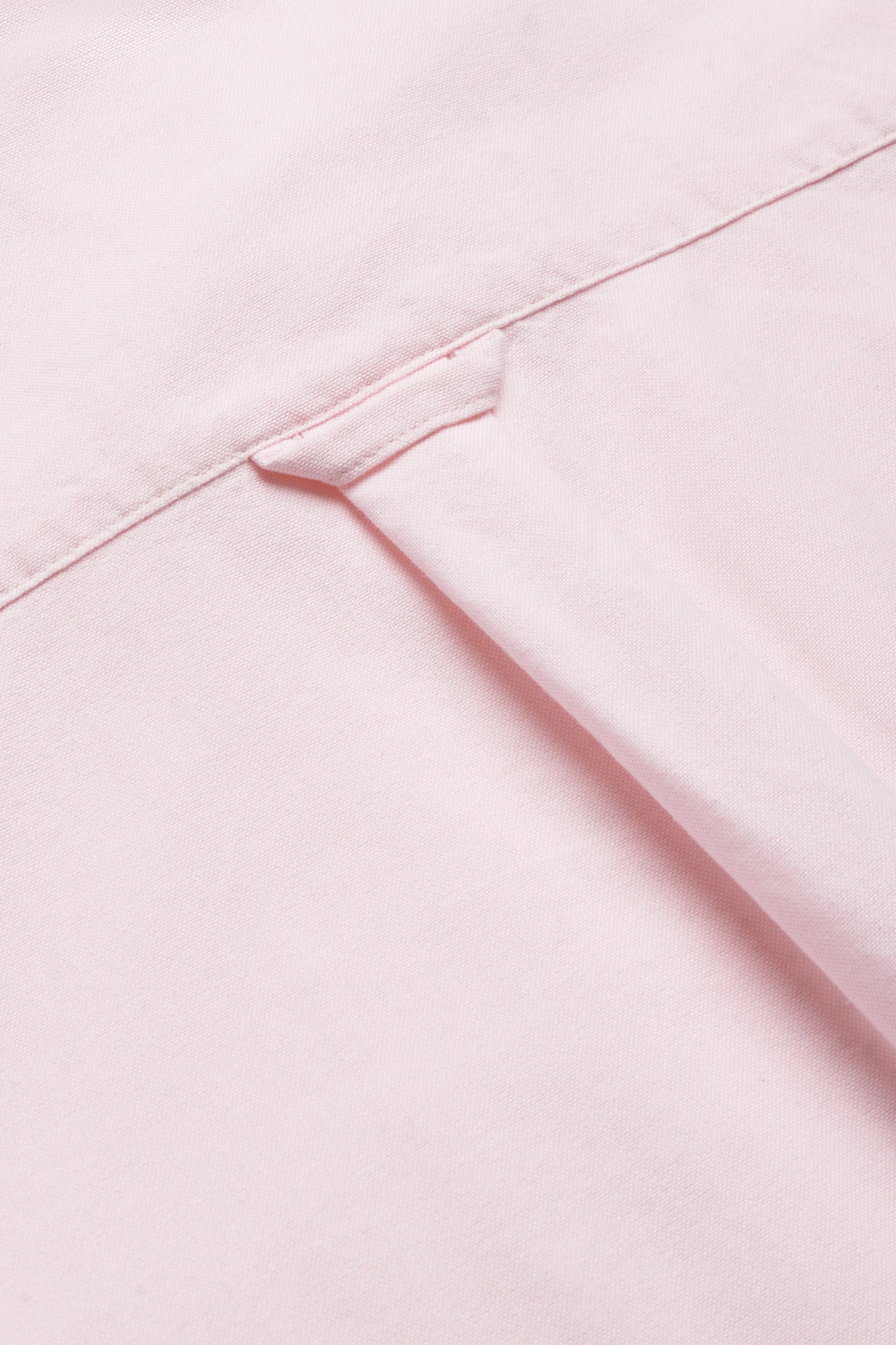 Unisex long-sleeved shirt, organic cotton, rose, with visible collar detail.