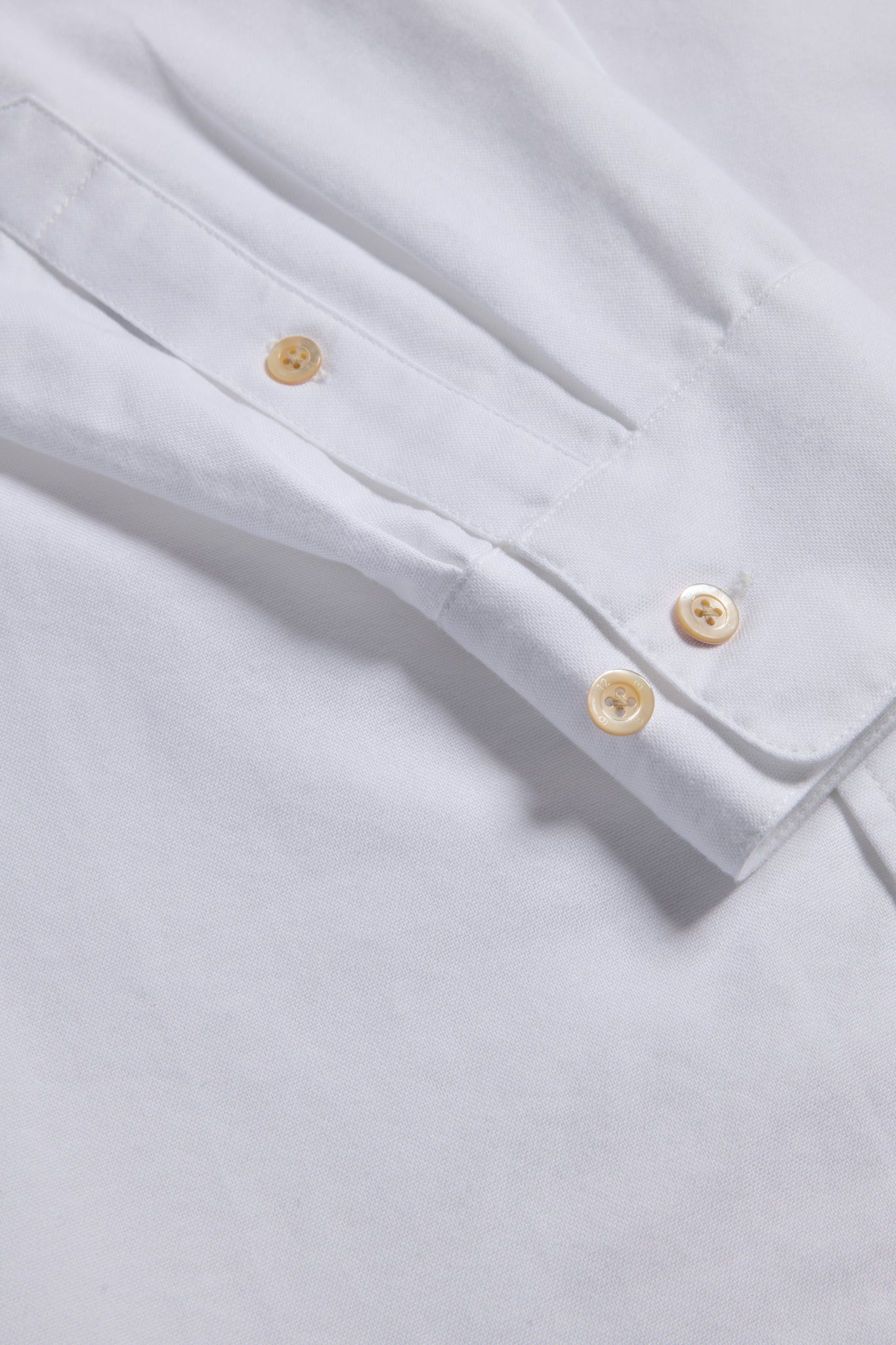 Men's/Women's long-sleeved shirt, 100% organic cotton, white, with pearl buttons on cuff.