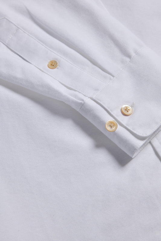 Men's/Women's long-sleeved shirt, 100% organic cotton, white, with pearl buttons on cuff.