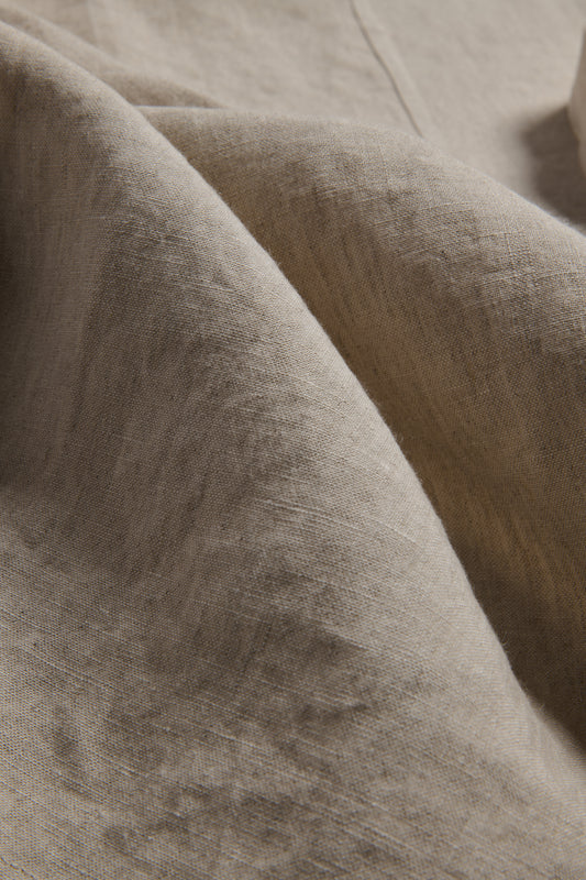 Unisex accessories apron, 100% Belgian linen, flax color, with visible texture and folds.