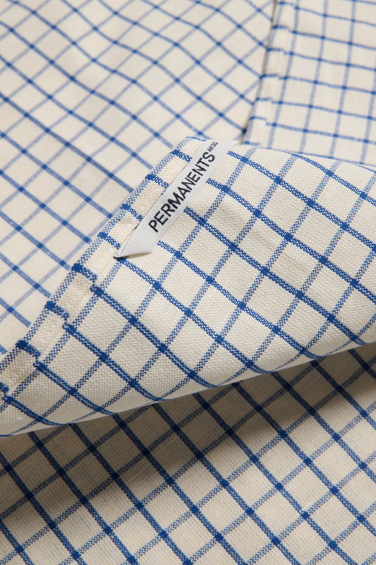 Accessories tea towel, linen-cotton blend, indigo check pattern, with "PERMANENTS" label.