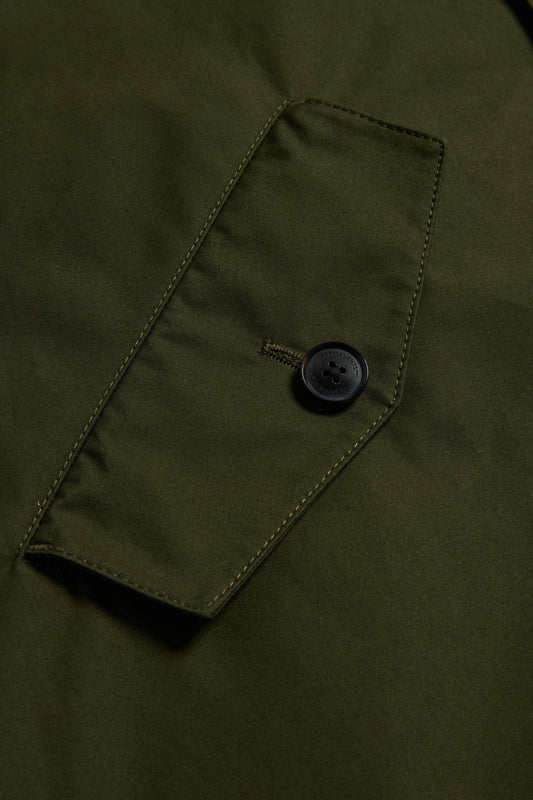 Men's outerwear parka, organic cotton, olive, with a flap pocket and black button.