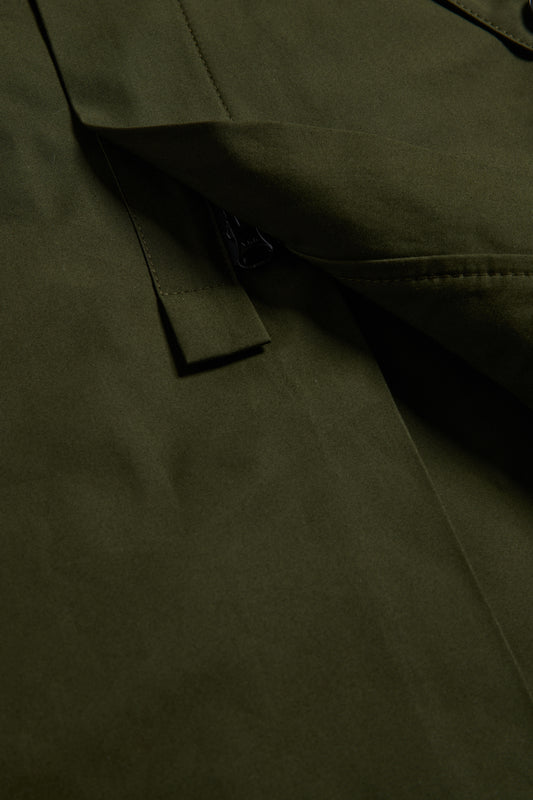 Unisex outerwear parka, organic cotton EtaProof® fabric, olive, with flap pocket and zipper detail.