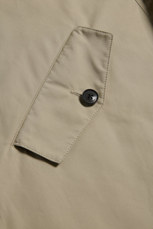 Men's outerwear parka, organic cotton, stone, with flap pocket and black button.
