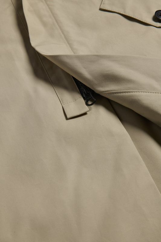 Unisex outerwear parka, organic Swiss EtaProof® cotton, stone, with flap pockets and zipper detail.