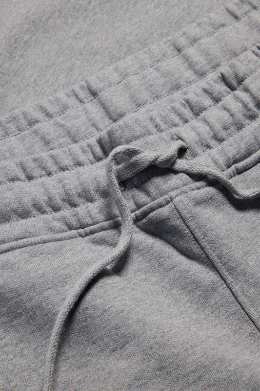 Unisex jersey long-pants, organic cotton, grey melange, with elastic waistband and drawstring.