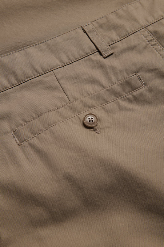 Men's long-pants, washed beige organic cotton twill, with a button-up box back pocket.