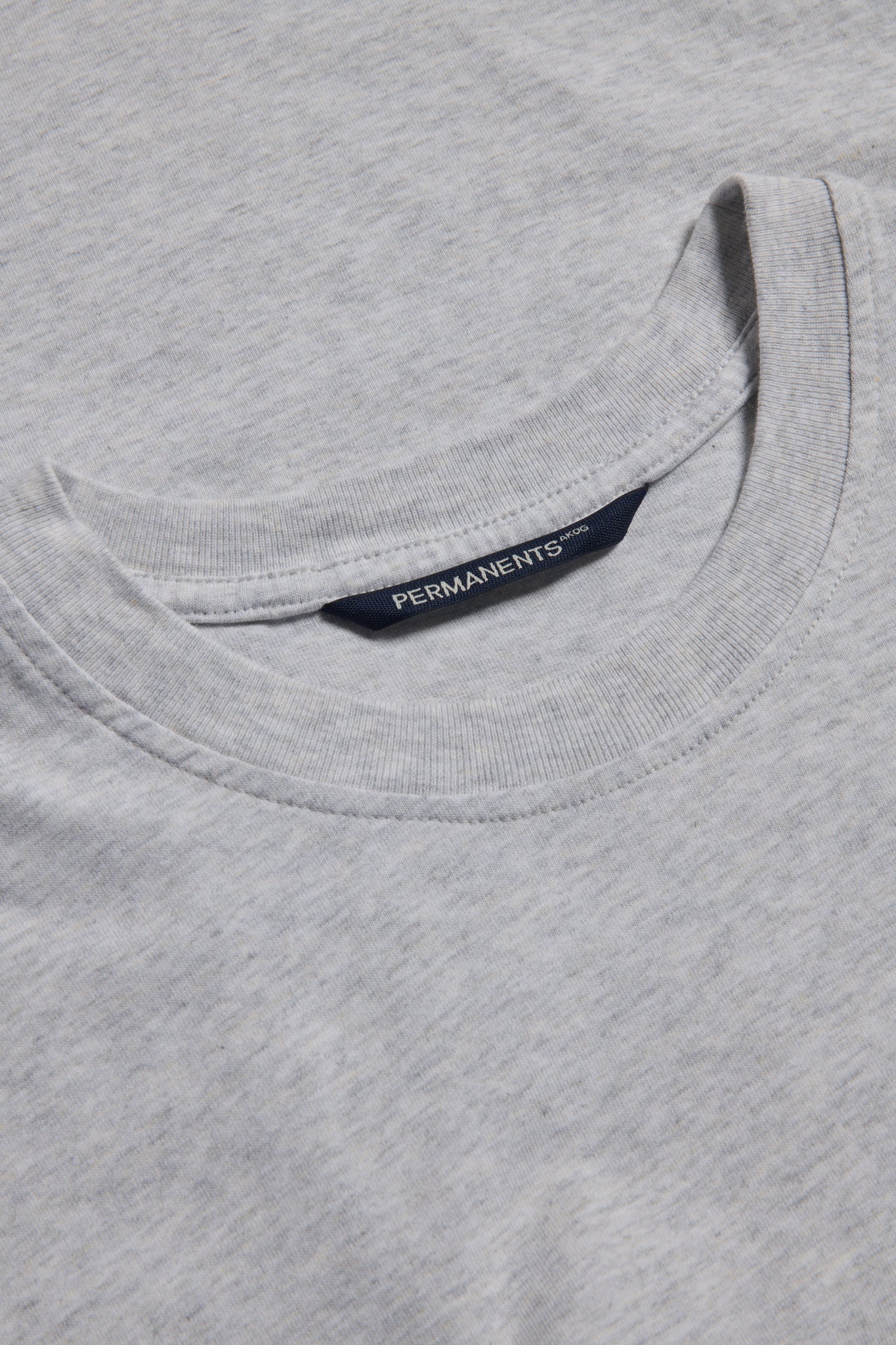 Men's/Women's jersey short-sleeved shirt, 100% organic cotton, pre-washed, heather grey, with "PERMANENTS" neck label.