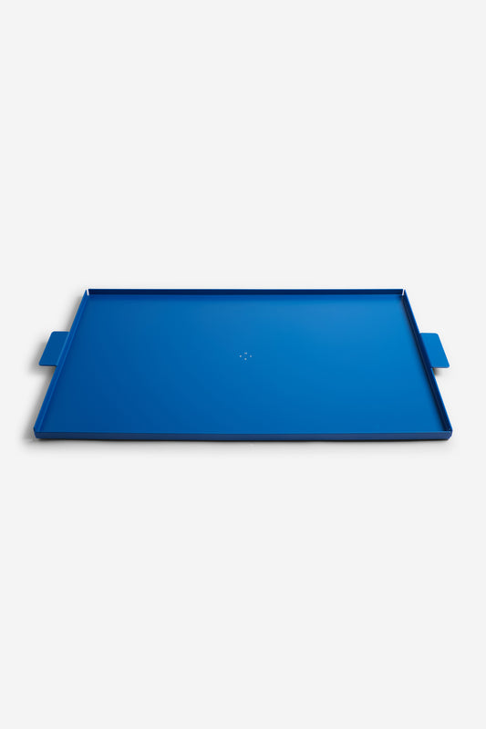 Accessories tray, gentian blue aluminum, 53x34cm, with subtle handles.