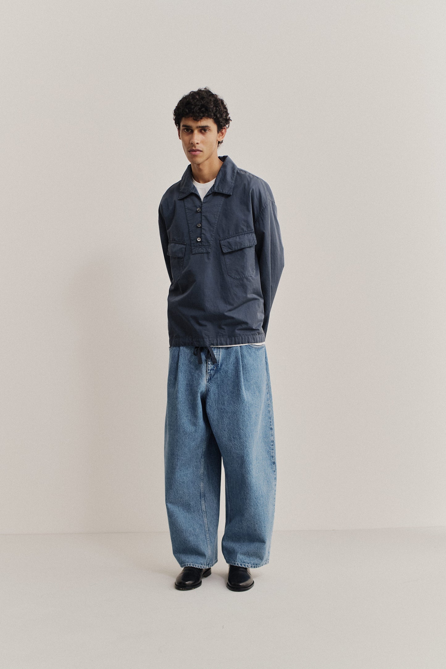 Men's long-sleeved shirt jacket, cotton-linen blend, garment dyed navy, with patch pockets and spread collar.