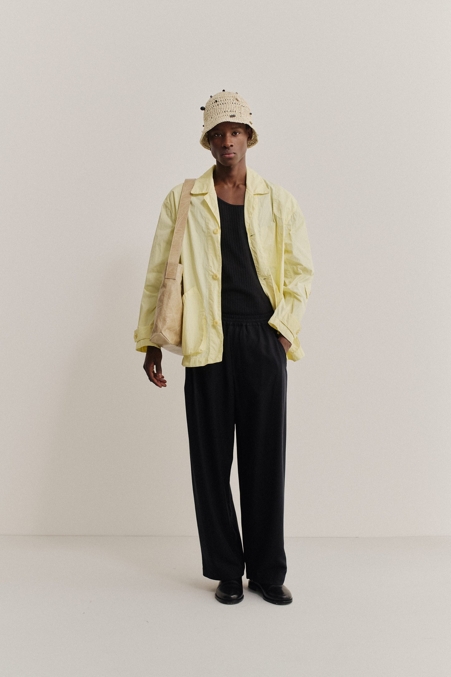 Men's outerwear jacket, recycled polyamide, garment-dyed washed light yellow Matoke Jacket with vintage lapel.