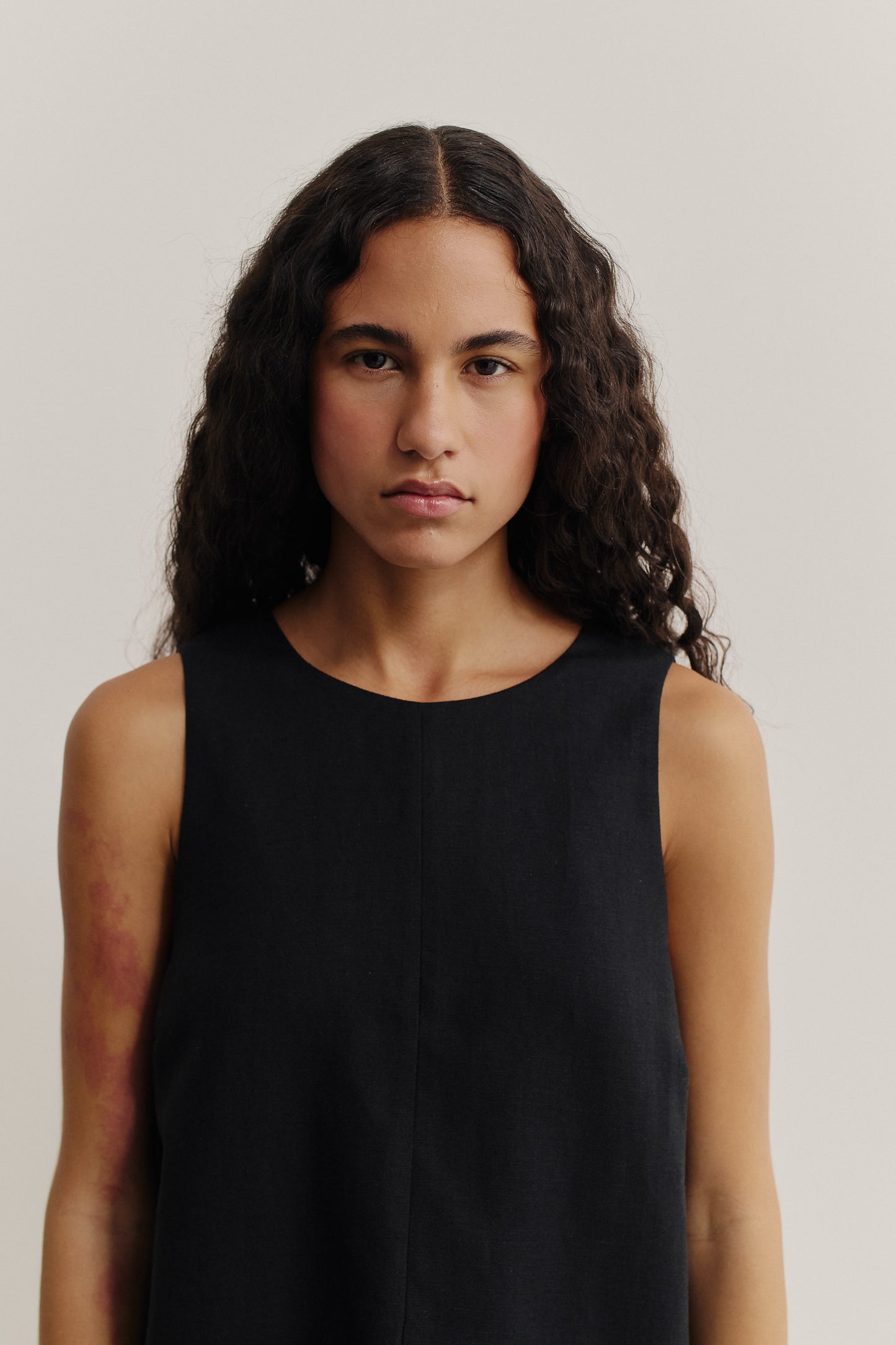Women's dress, sleeveless, black worsted wool and linen blend, round neck, oversized silhouette.