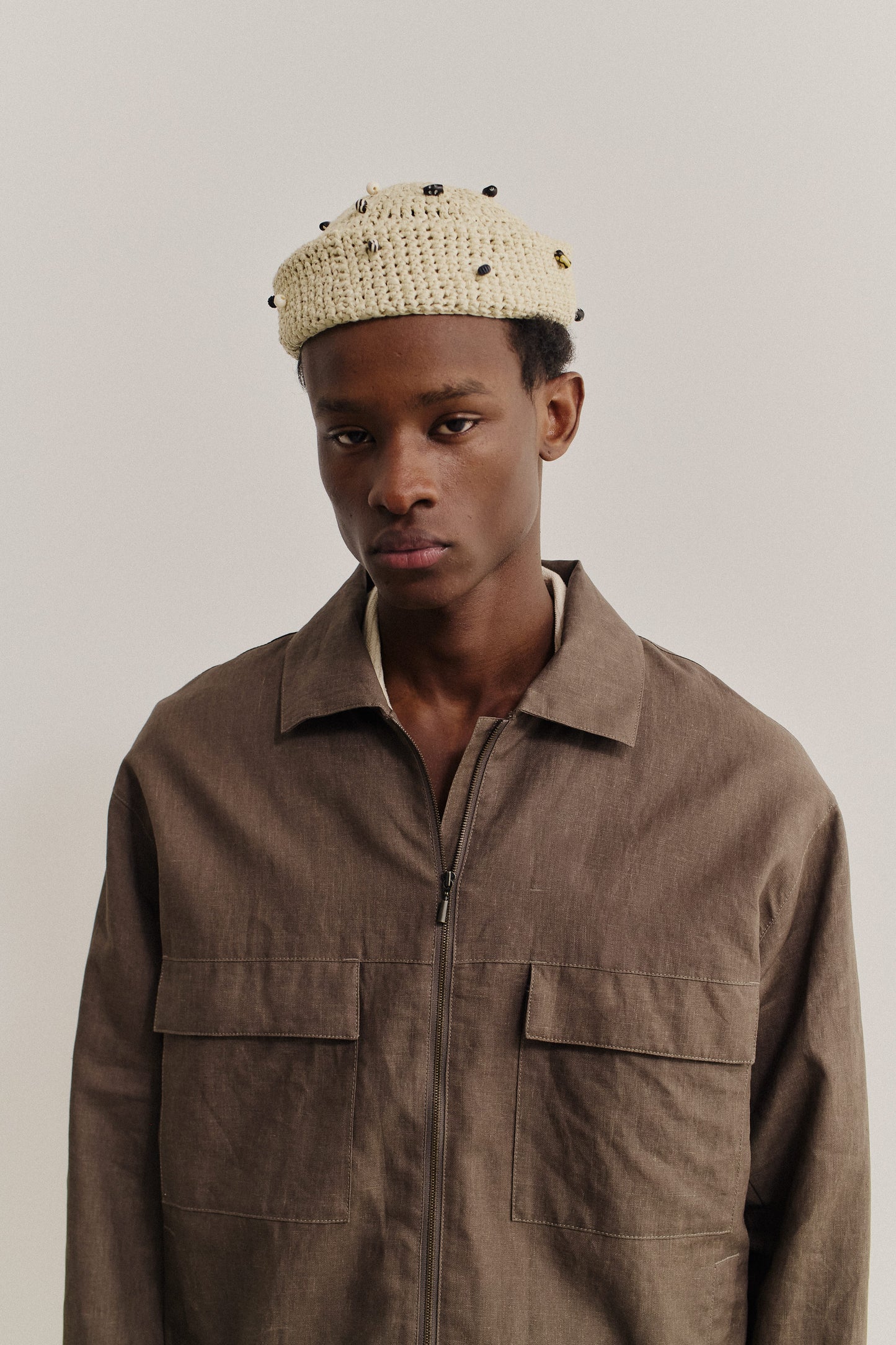 Men's outerwear, Embu jacket, 100% linen, soft coated, natural brown, with flap chest pockets and front zip.