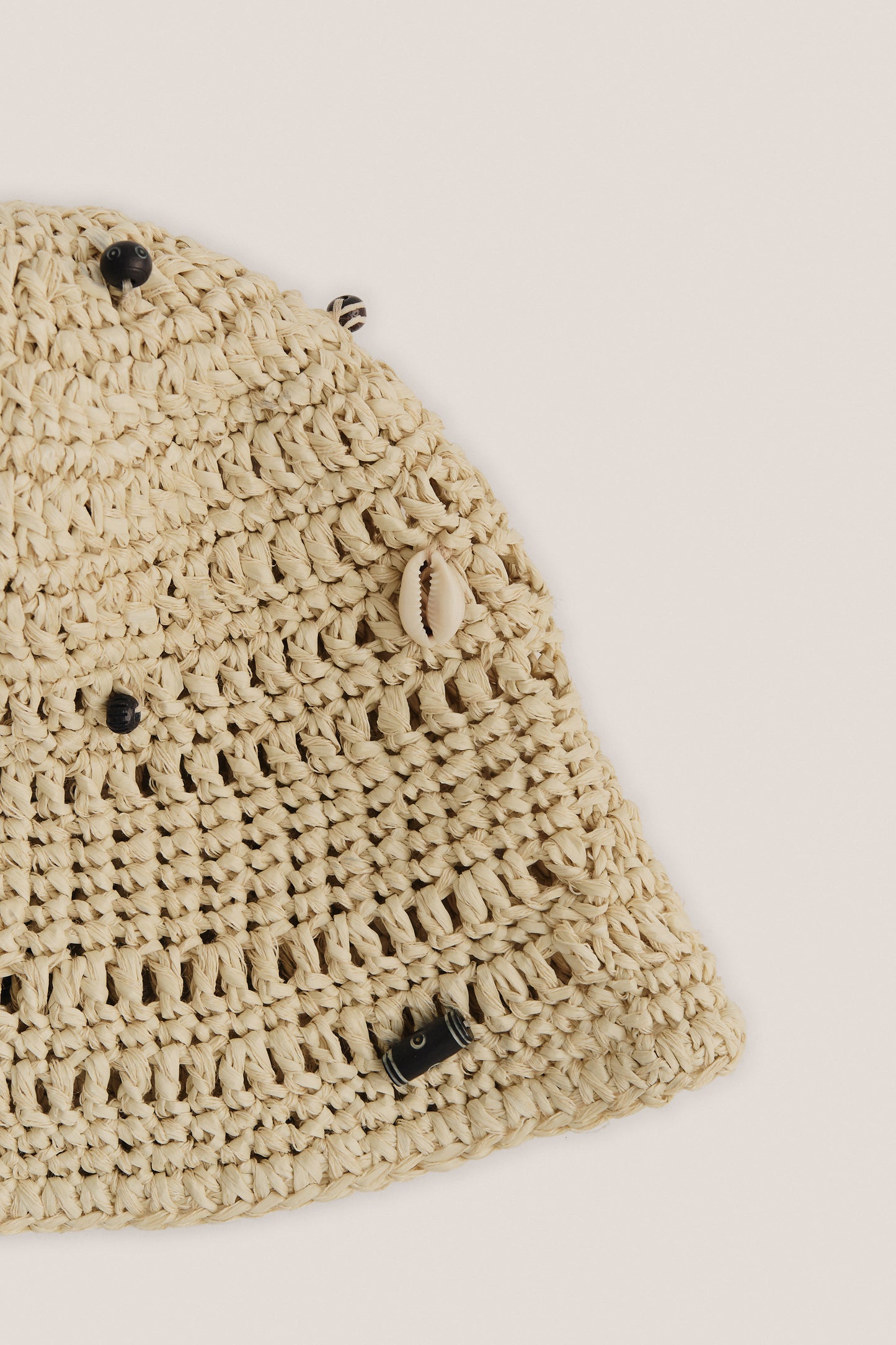 Women's accessories bucket hat, raffia-like viscose-linen-cotton blend, natural beige, with mussels and wooden beads.