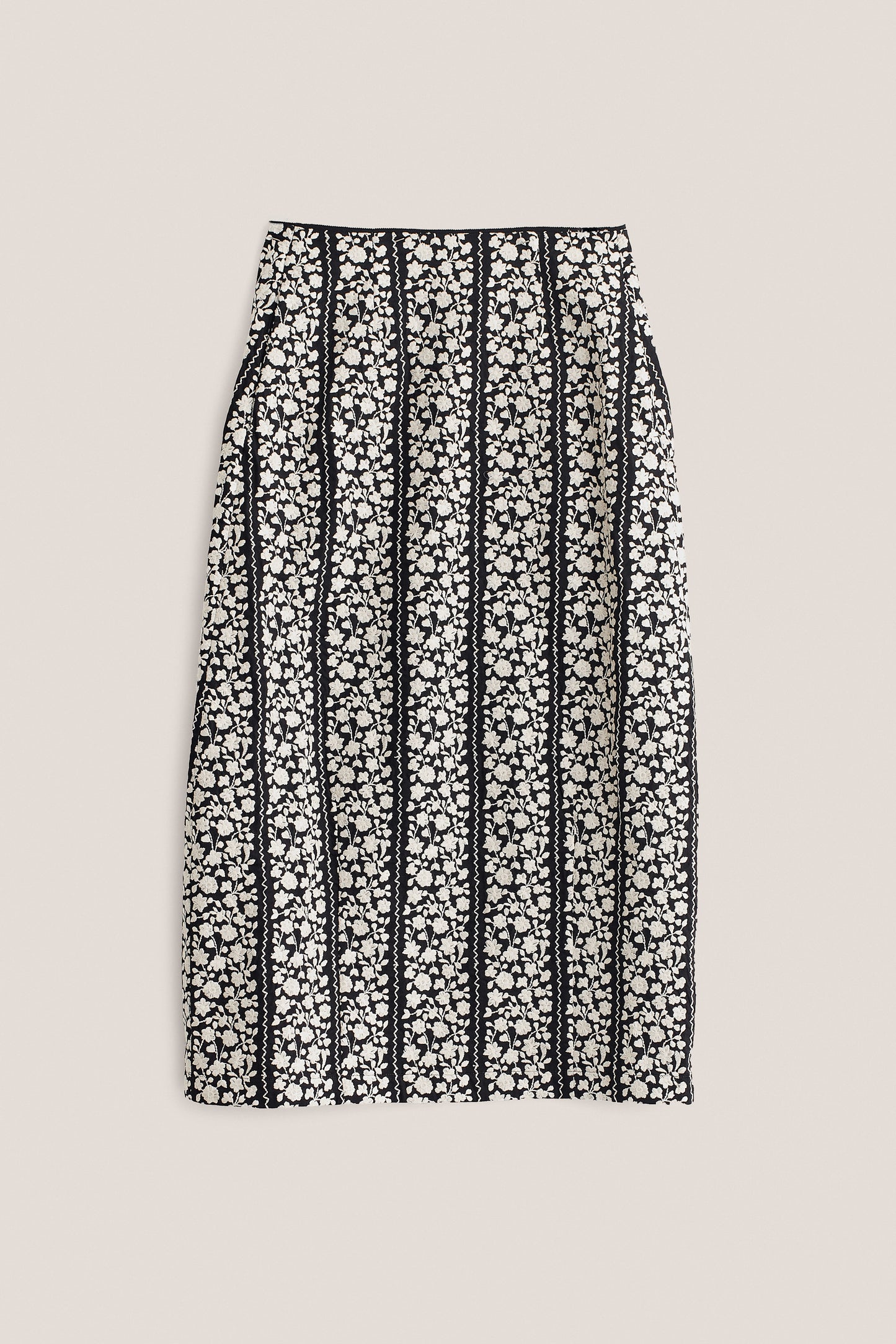 Women's skirt, midi, 100% cotton, black with white embroidered floral blocks and wavy lines.