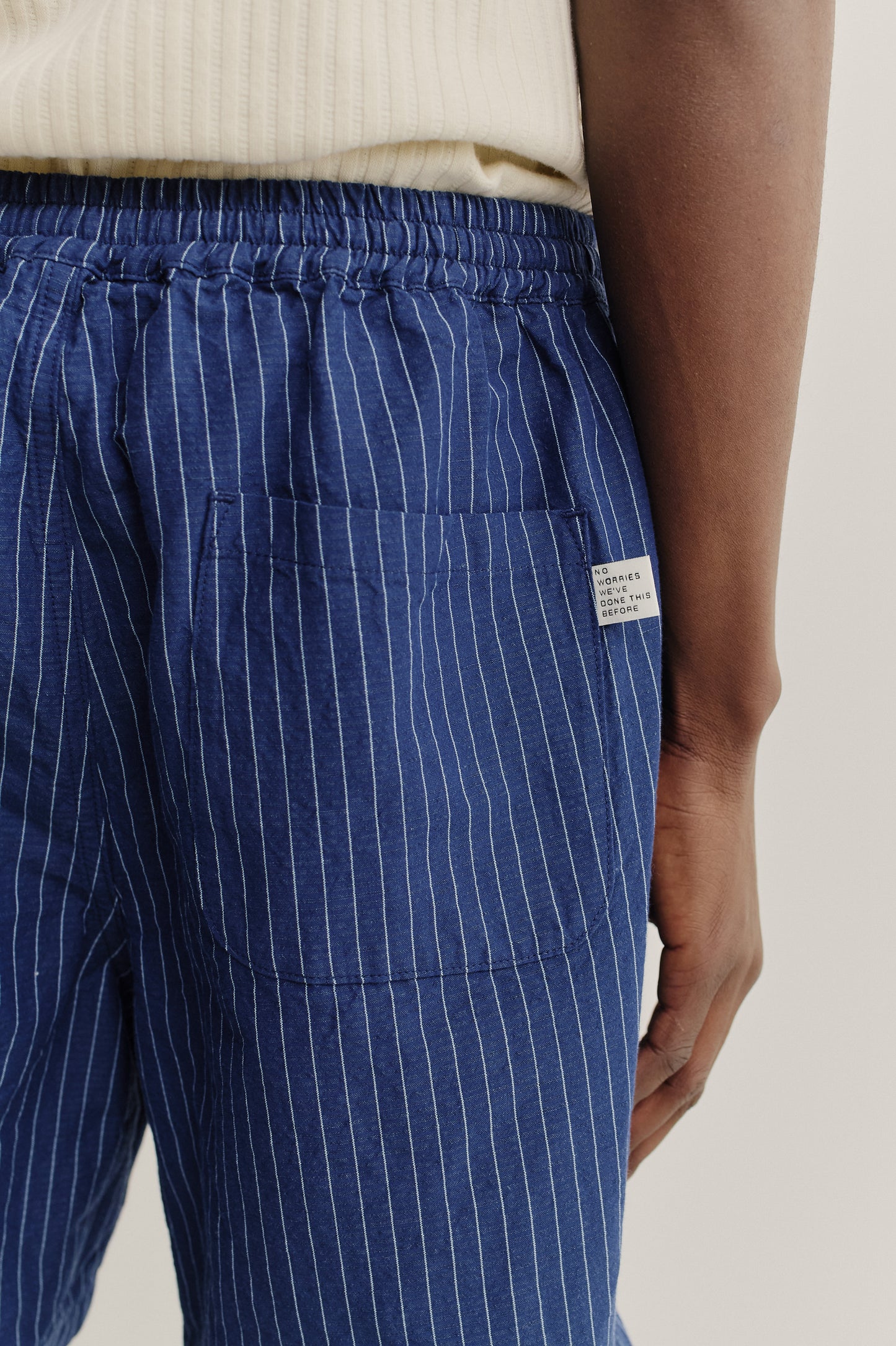 Men's shorts, cotton-linen seersucker, navy with white pinstripes, elastic waist, back patch pocket.