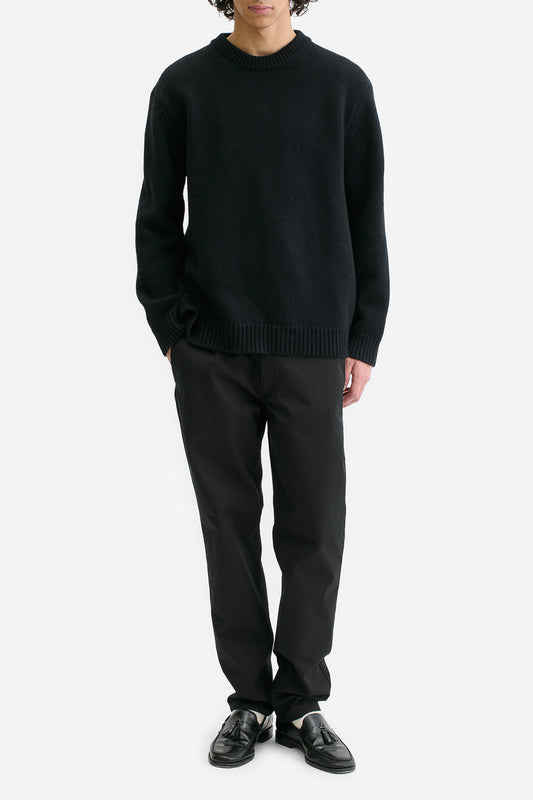 Men's knit pullover, black wool-cashmere blend, relaxed fit, rib-knit neck, cuffs, and hem.