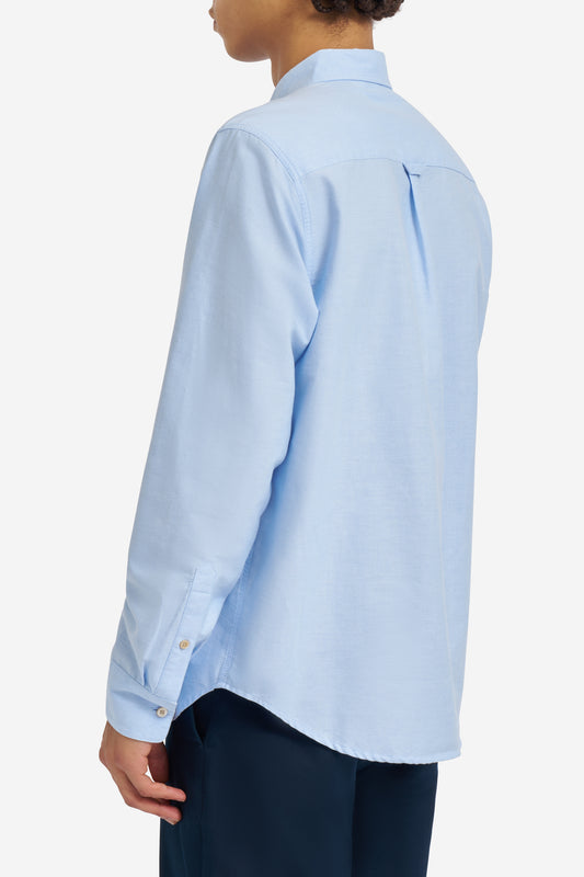 Men's long-sleeved shirt, organic cotton, light blue, with button cuffs and pearl buttons.