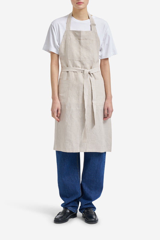 Women's accessories apron, 100% Belgian linen, flax color, with three patch pockets and adjustable neck strap.