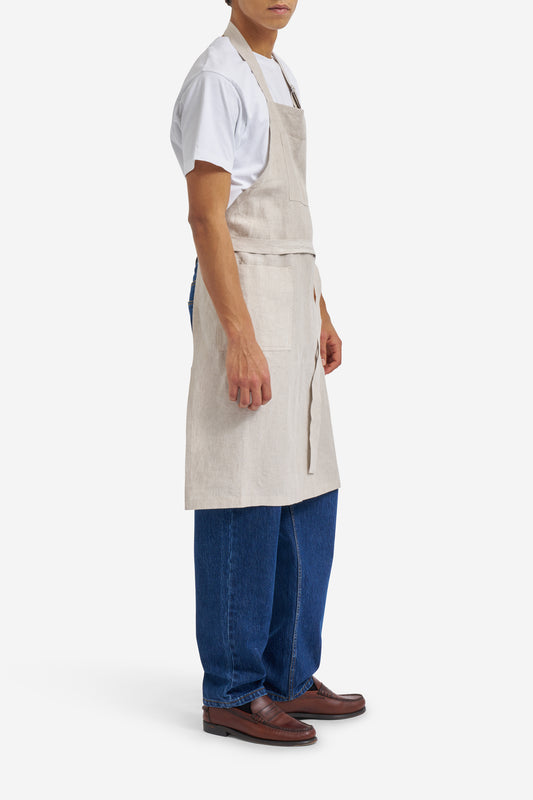 Men's accessories apron, 100% Belgian linen, flax color, with three patch pockets and adjustable neck strap.