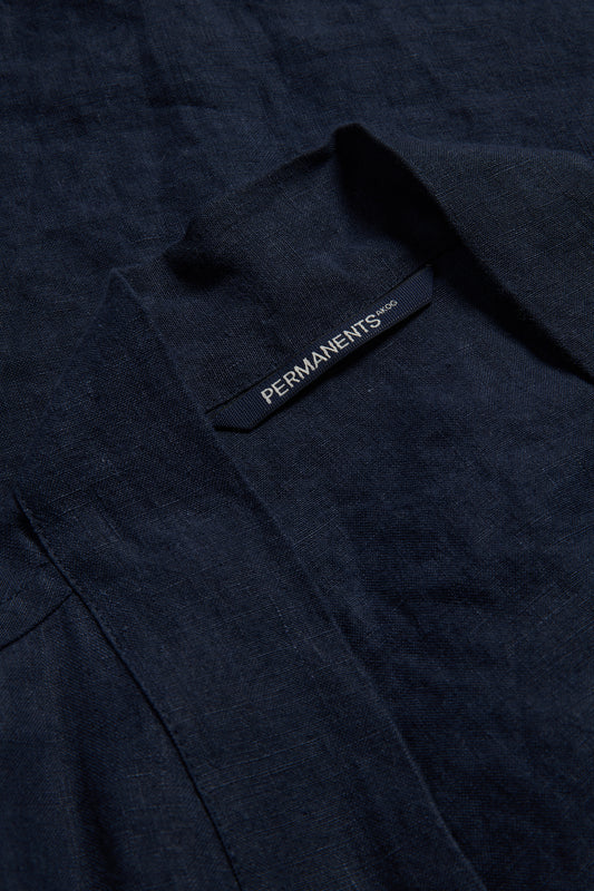 Unisex bathrobe, navy 100% Belgian linen, Kimono-inspired with "PERMANENTS" label and patch pocket.