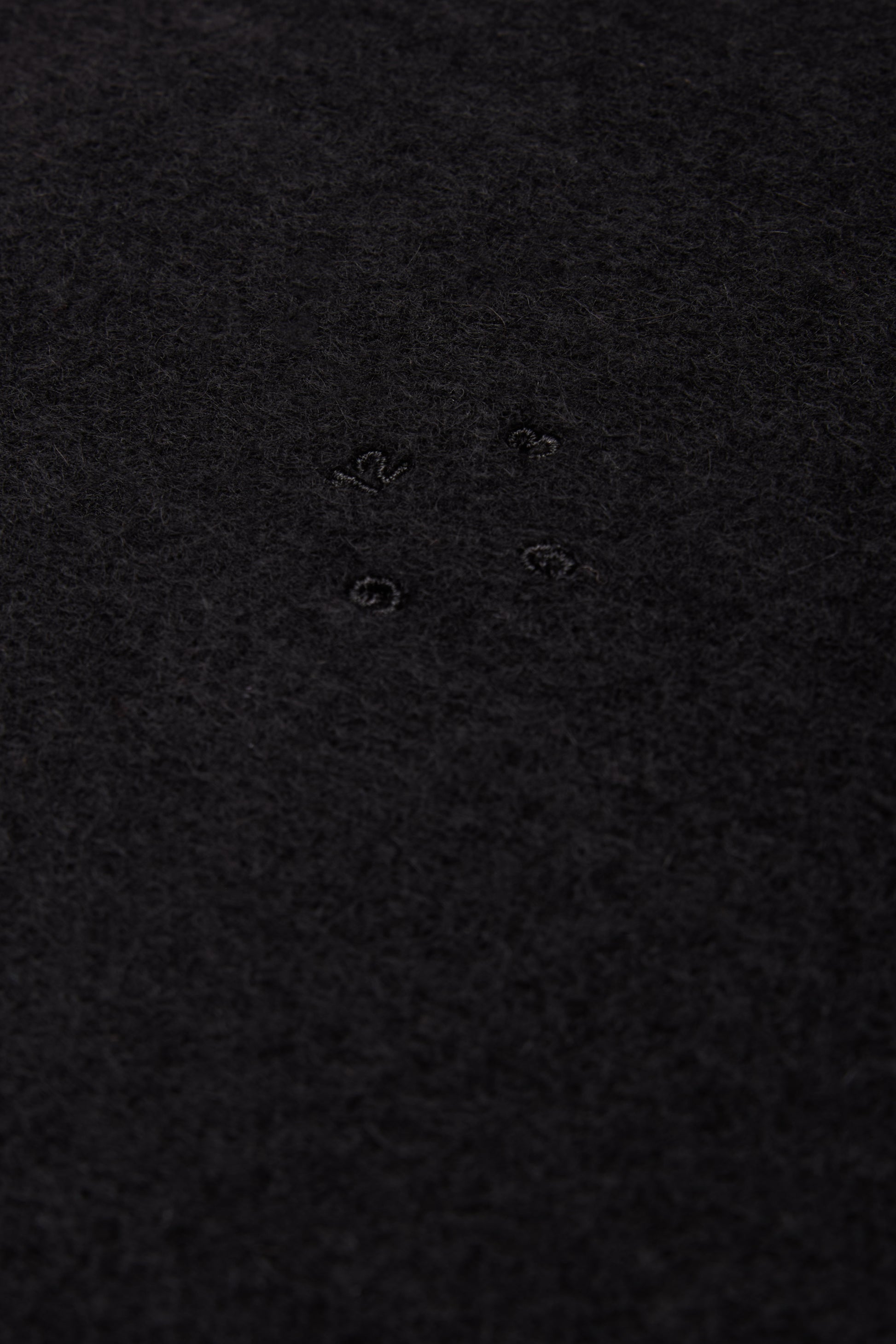 Unisex accessories cashmere scarf, black, with subtle embroidered details.