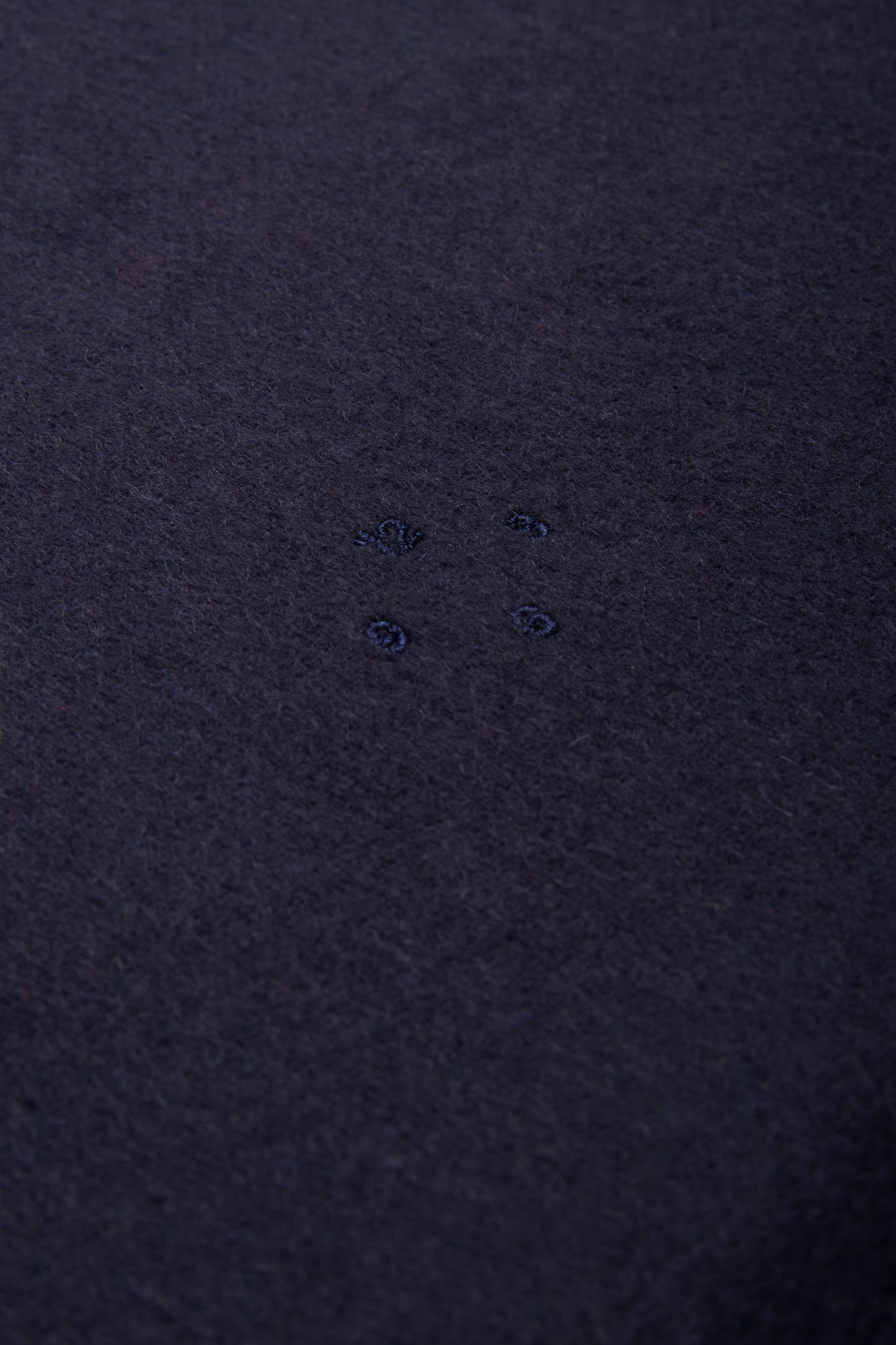 Women's accessories cashmere scarf, navy, with subtle embroidered details.