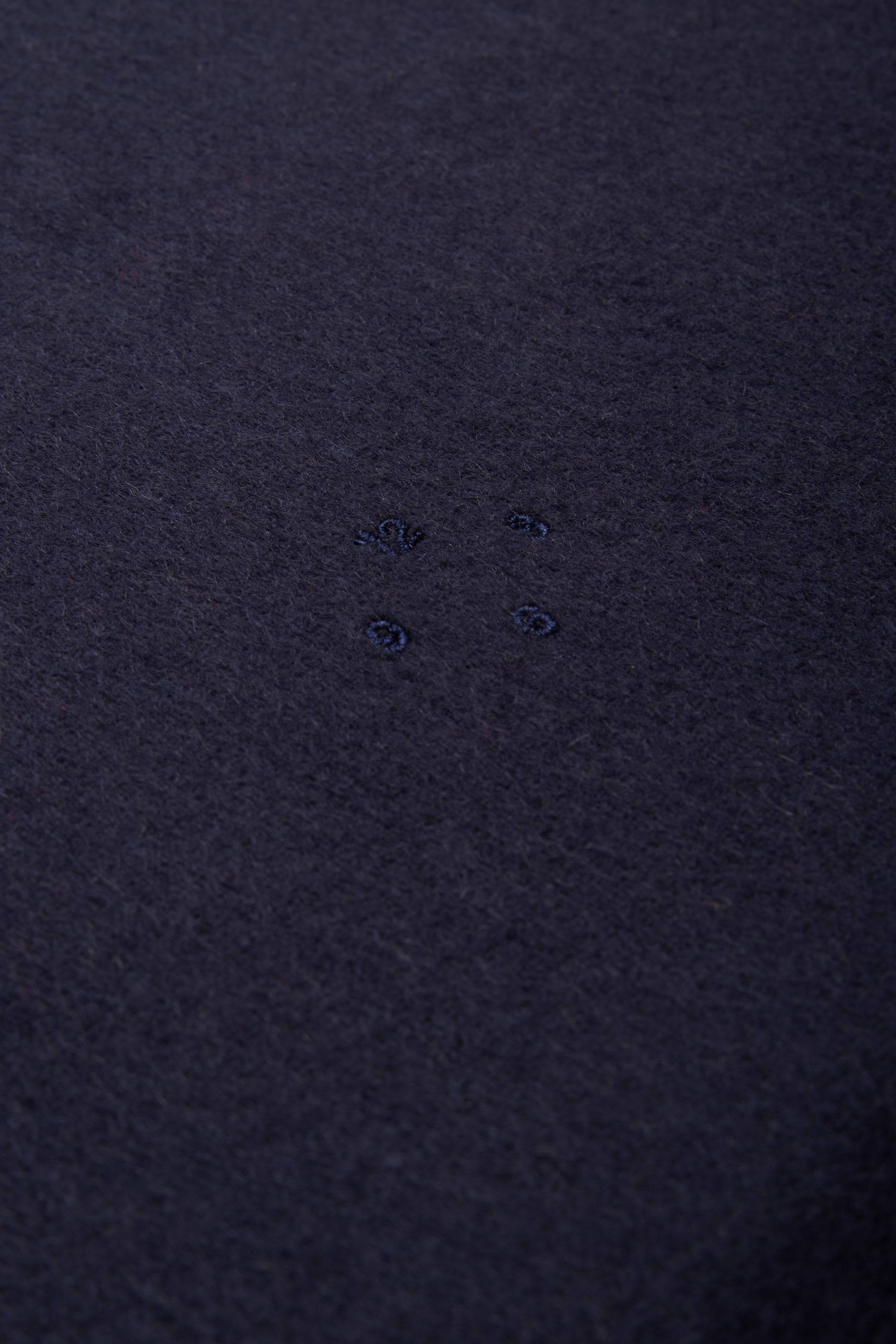 Women's accessories cashmere scarf, navy, with subtle embroidered details.