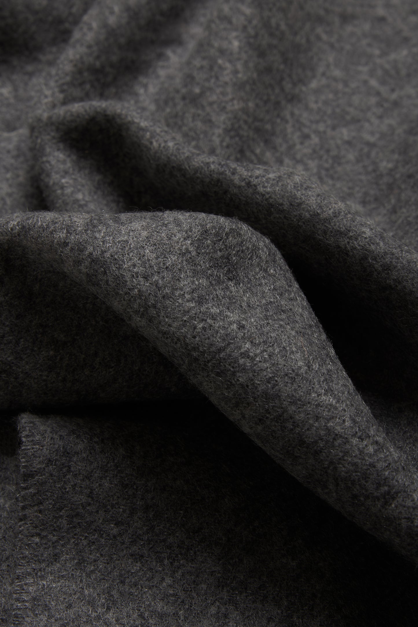 Women's accessories cashmere scarf, grey melange, soft texture, folded.