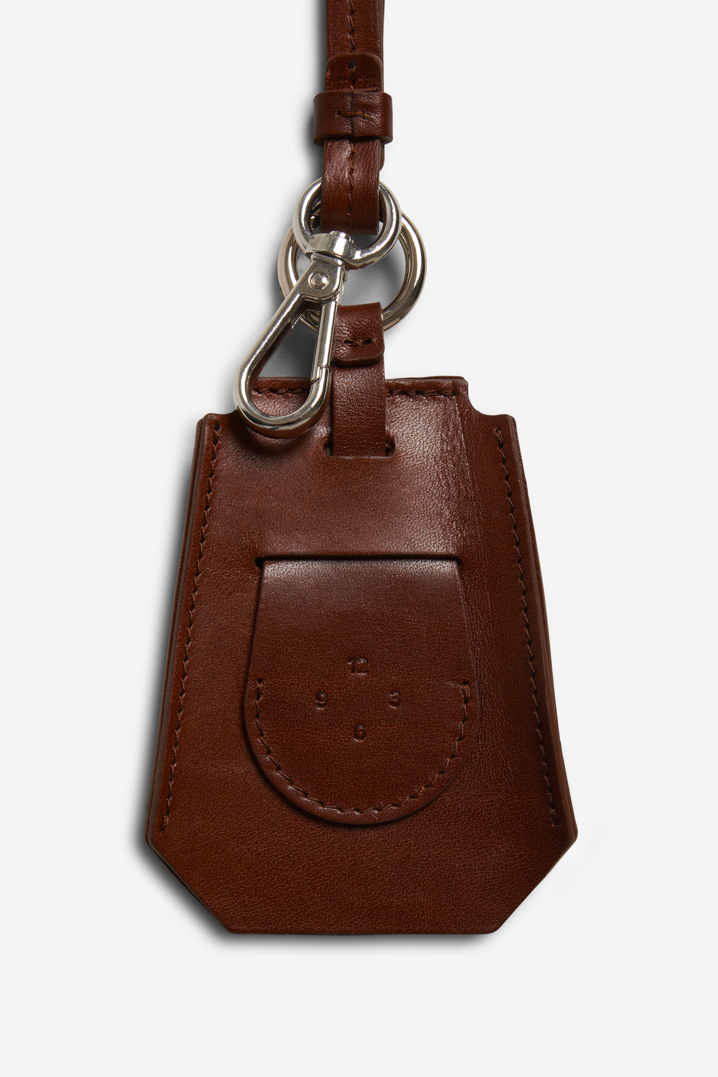Unisex accessories key chain, vegetable-tanned leather, brown, with silver carabiner and tracker compartment.