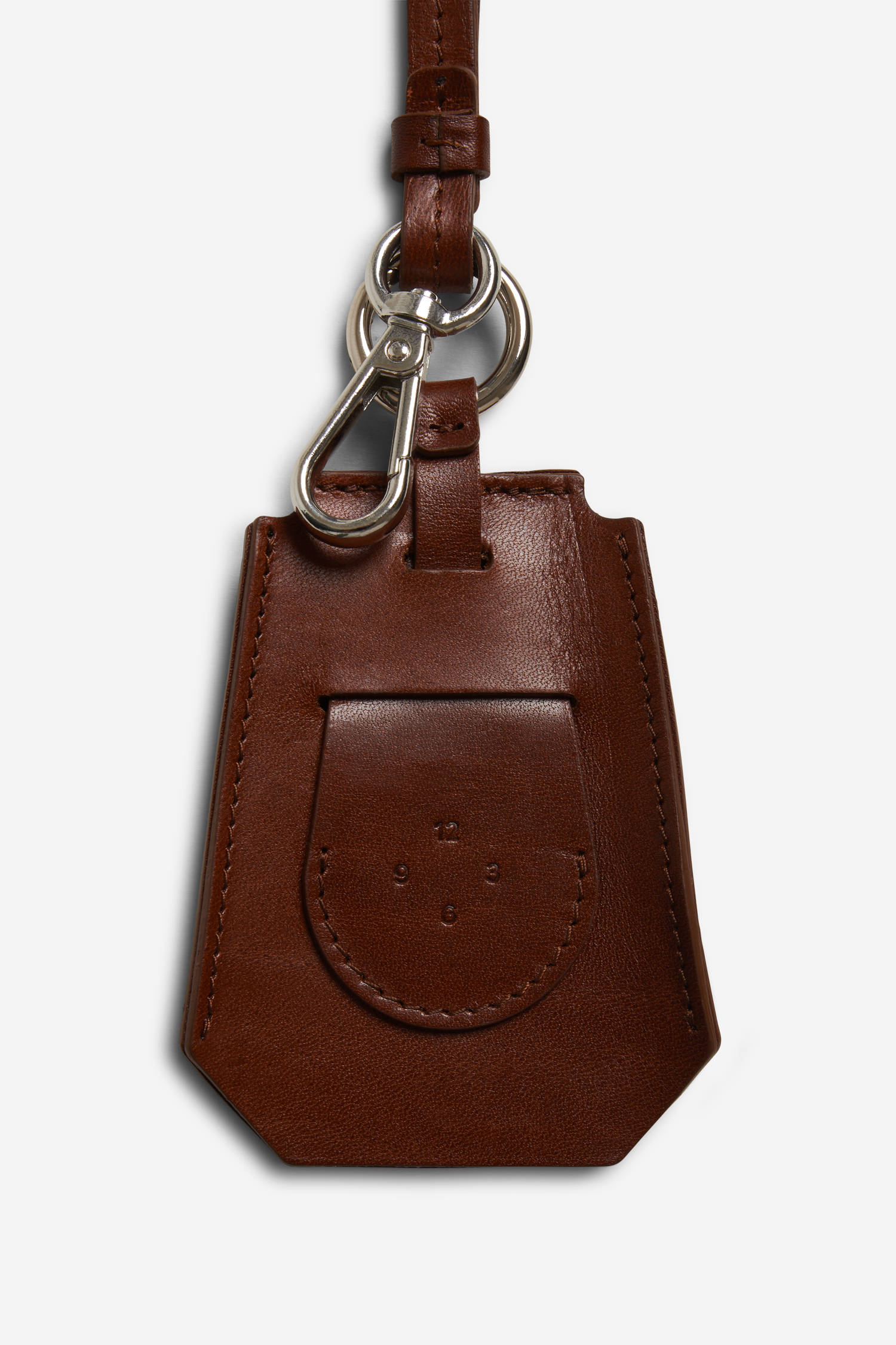 Unisex accessories key chain, vegetable-tanned leather, brown, with silver carabiner and tracker compartment.