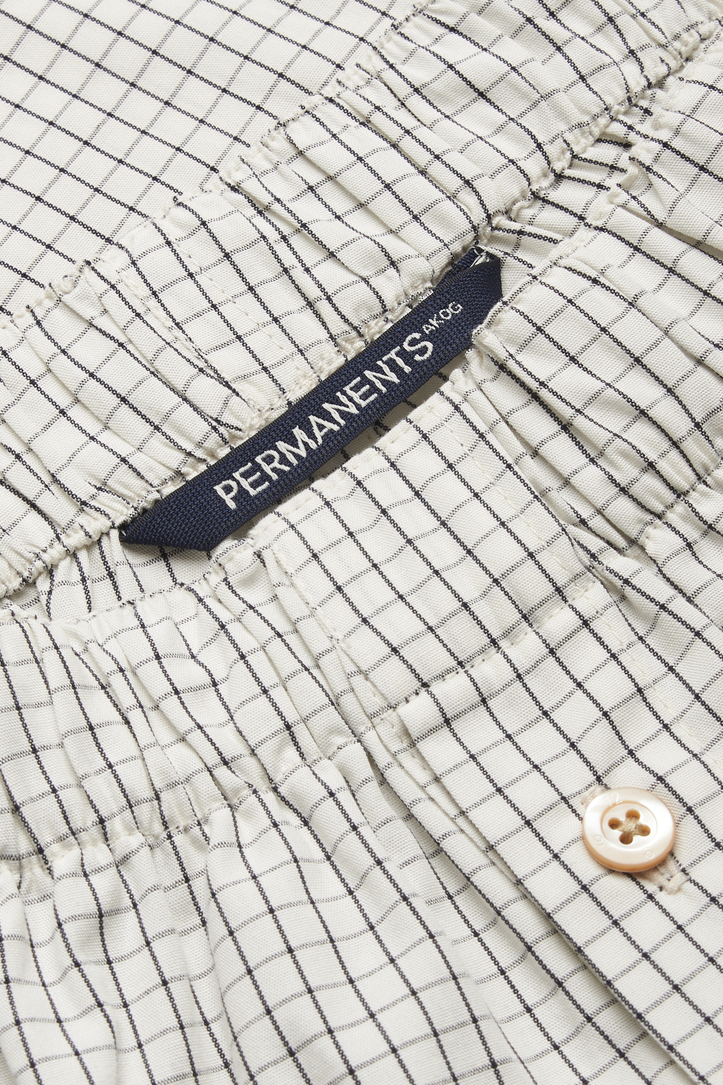 Men's jersey boxershorts, organic cotton, white with black grid pattern, elastic waistband, button closure.