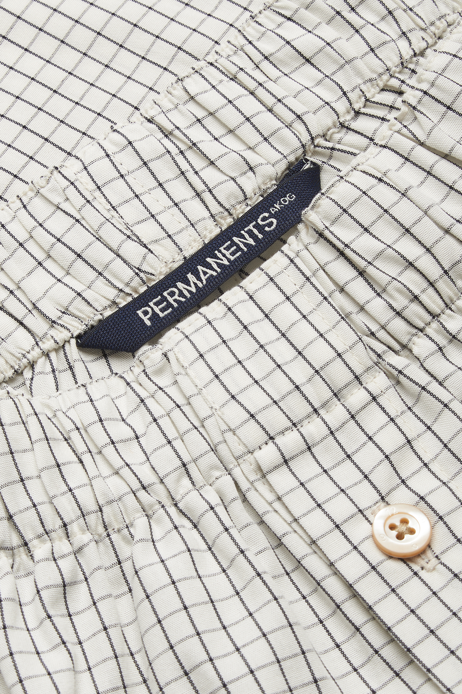 Men's jersey boxershorts, organic cotton, white with black grid pattern, elastic waistband, button closure.