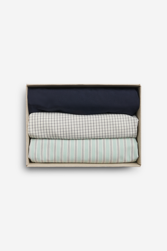 Men's jersey boxershorts, 100% organic cotton, night sky, white grid, and light green stripe, folded in a box.