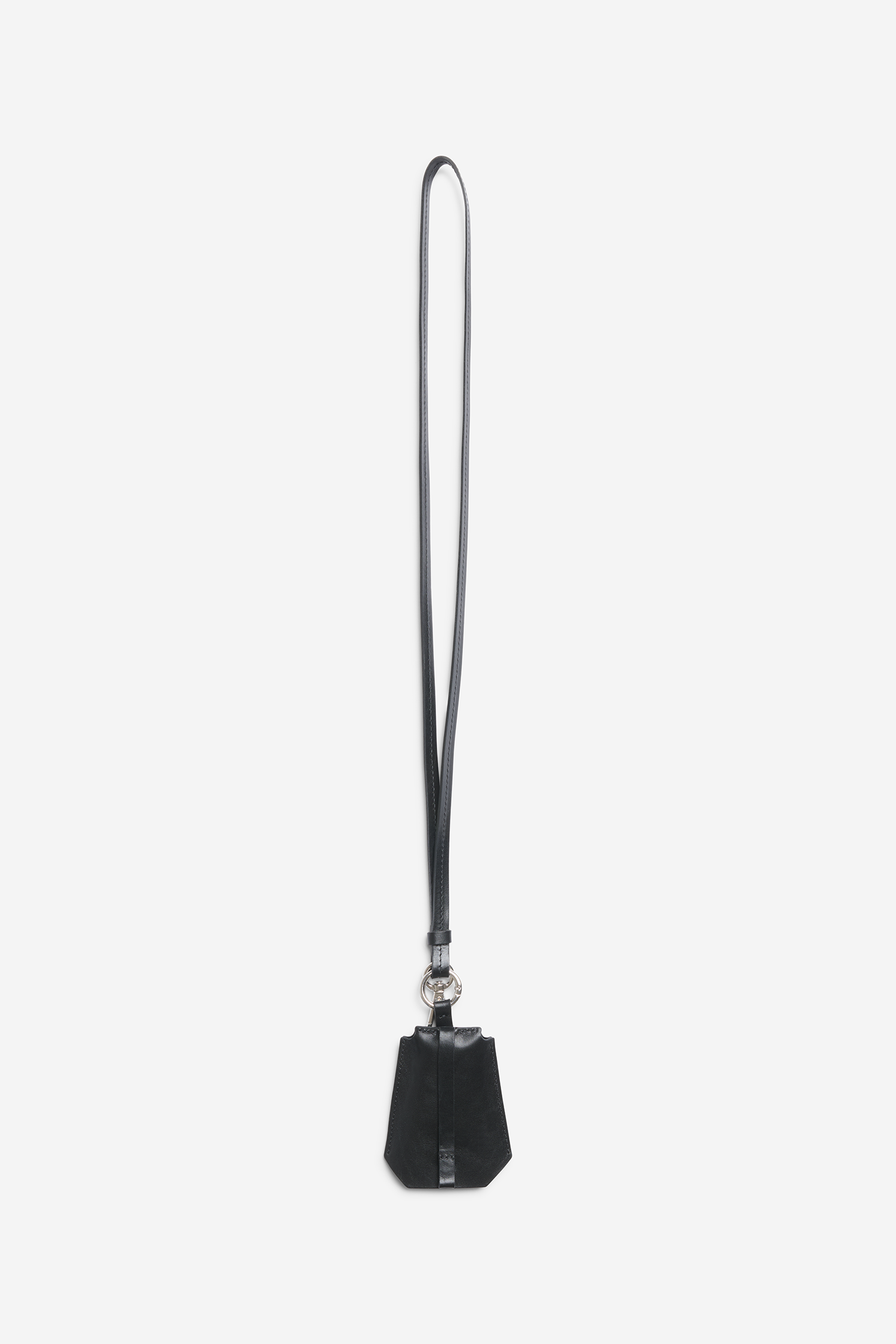 Unisex accessories key chain, vegetable-tanned leather, black, with long strap and Bluetooth tracker compartment.