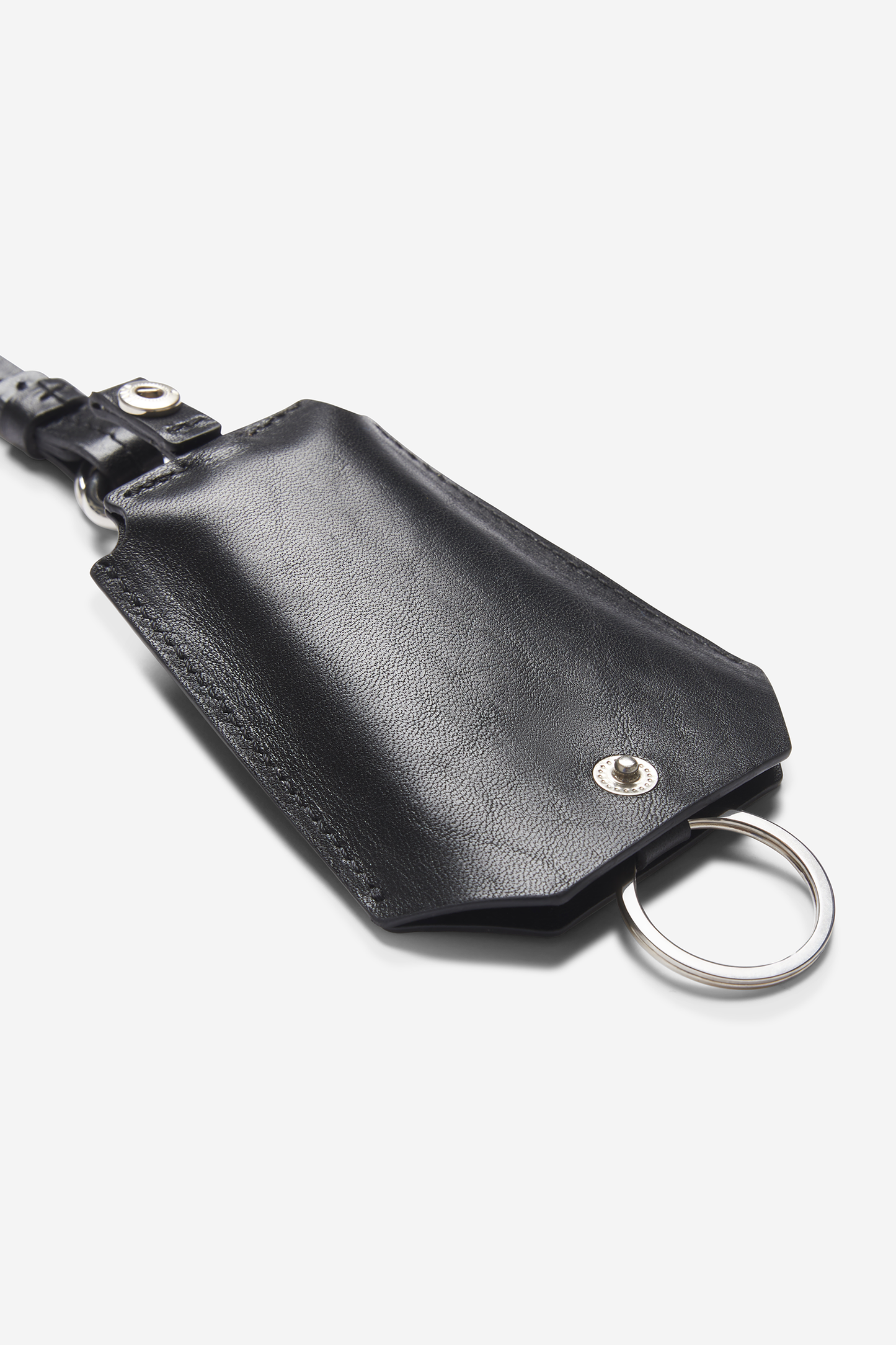Unisex accessories key chain, black vegetable-tanned leather with silver hardware and tracker compartment.