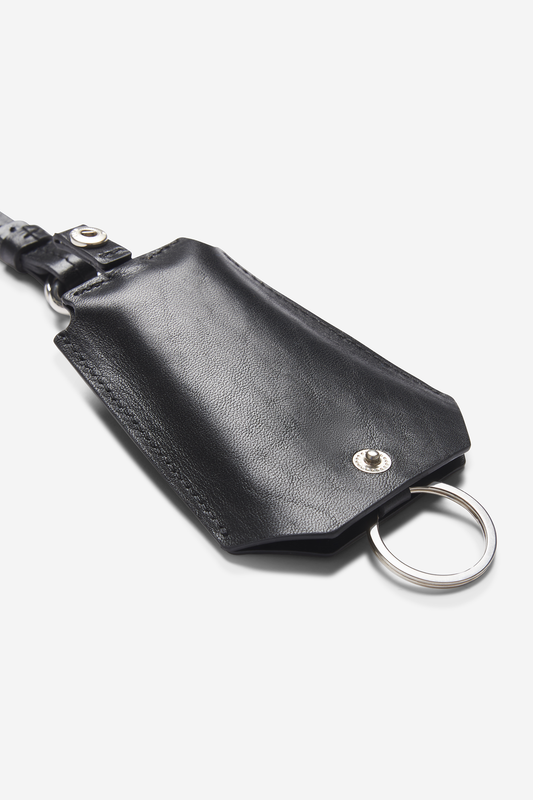 Unisex accessories key chain, black vegetable-tanned leather with silver hardware and tracker compartment.