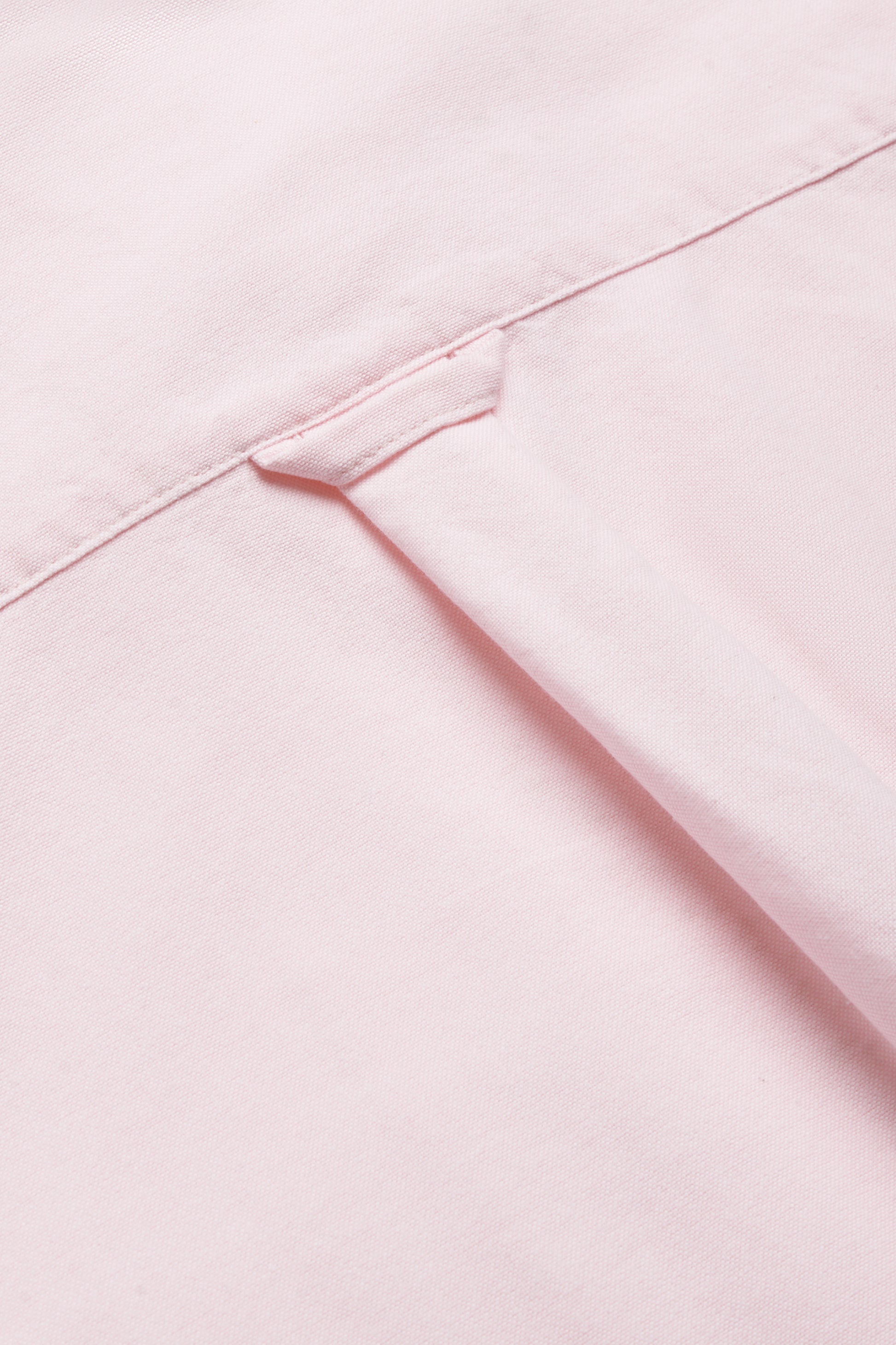 Unisex long-sleeved shirt, organic cotton, rose, with visible collar detail.