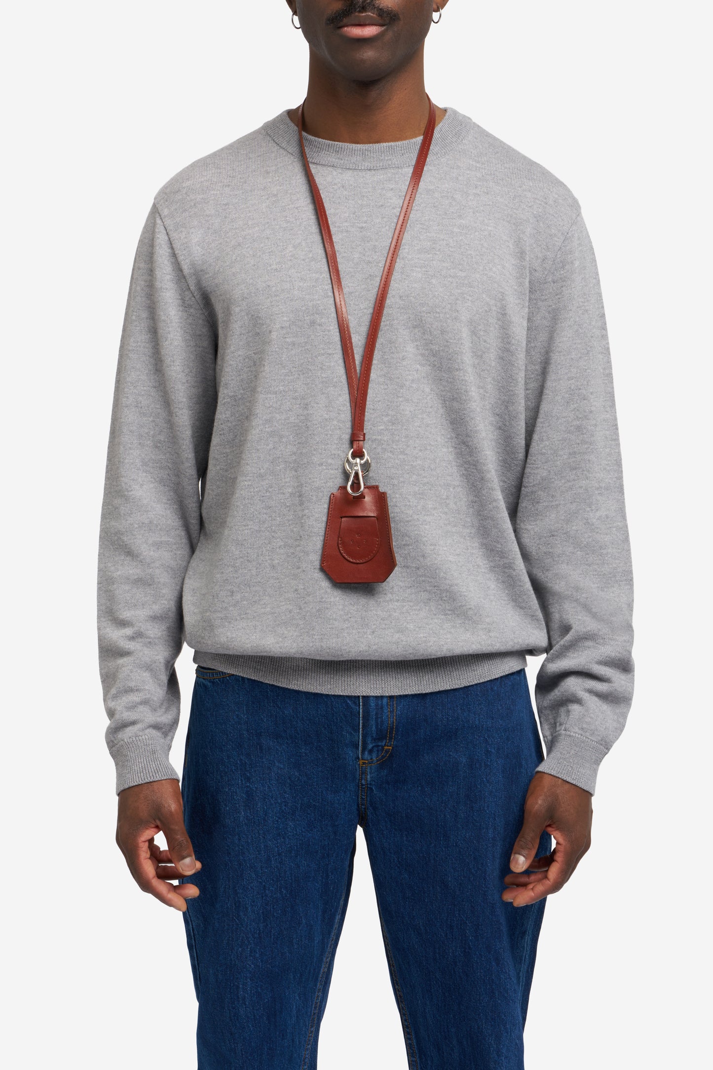 Men's accessories, key chain, vegetable-tanned leather, brown, worn around neck, with silver hardware.