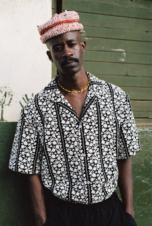 Men's short-sleeved shirt, 100% cotton, black with white embroidered floral blocks, notched collar.