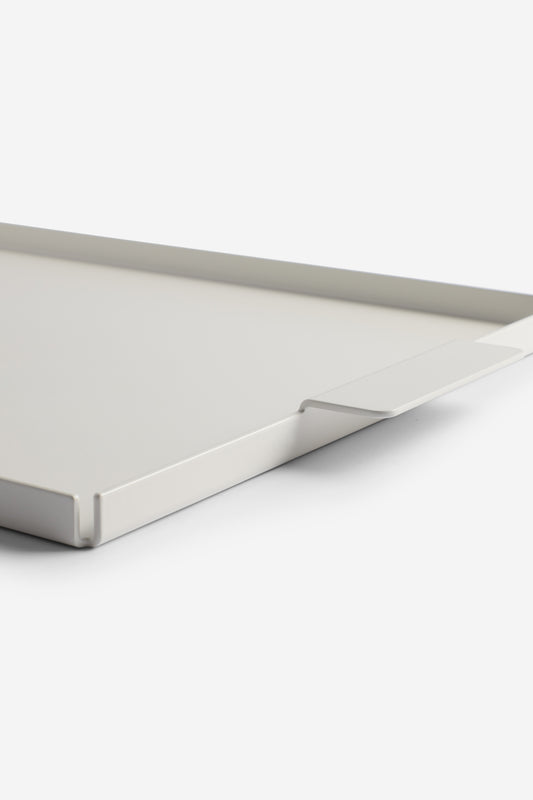 White coated aluminum tray, elegantly crafted from a single piece, with a minimalist design.