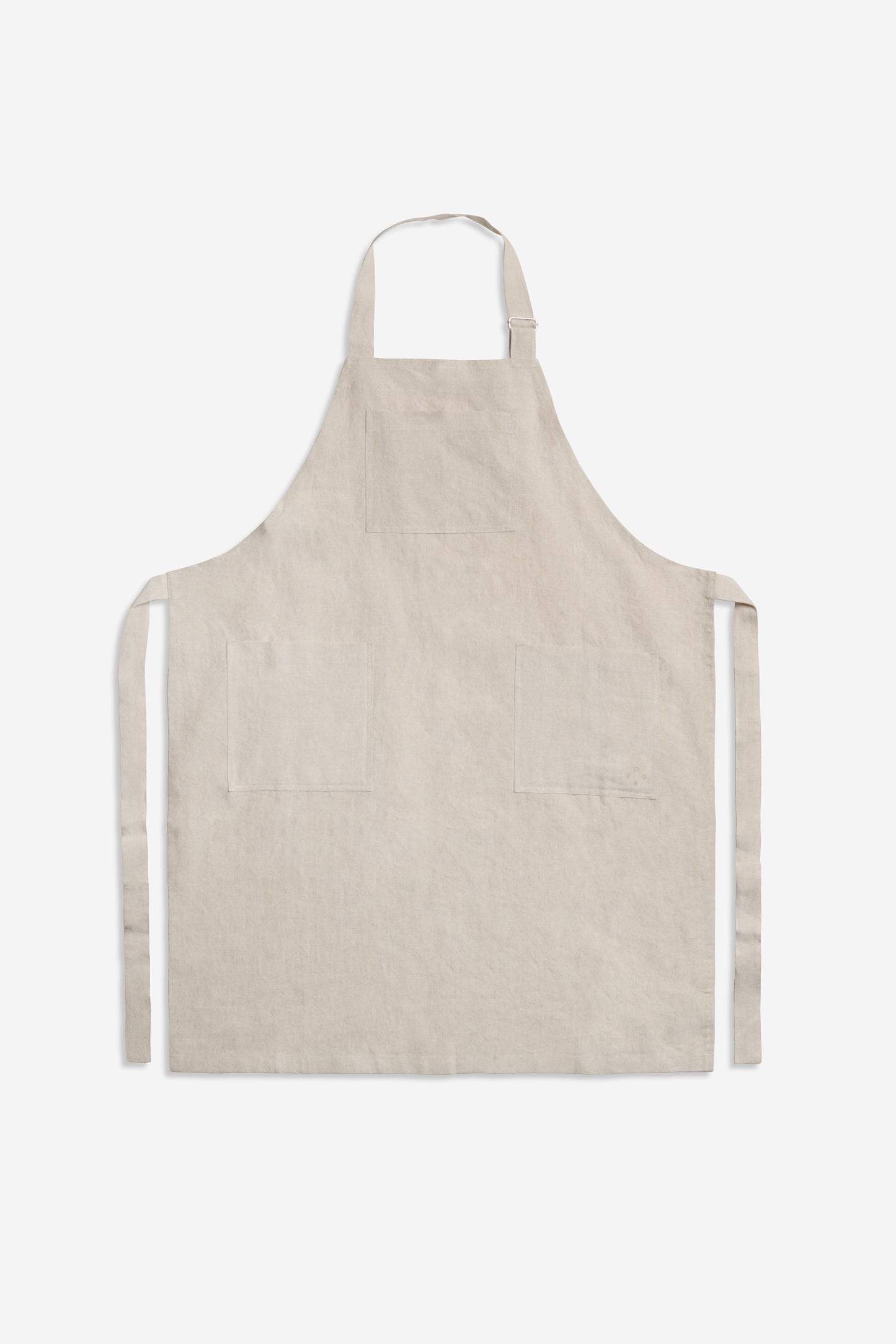 Unisex accessories apron, 100% Belgian linen, flax color with three patch pockets and adjustable neck strap.