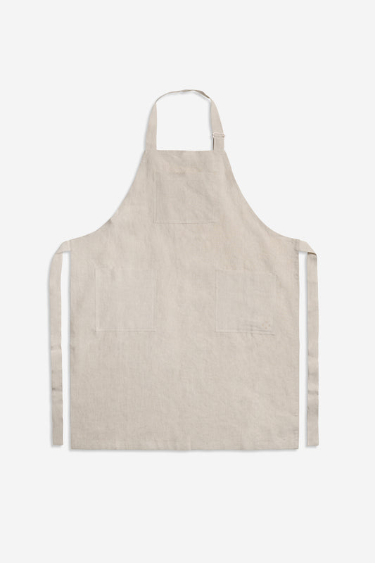 Unisex accessories apron, 100% Belgian linen, flax color with three patch pockets and adjustable neck strap.