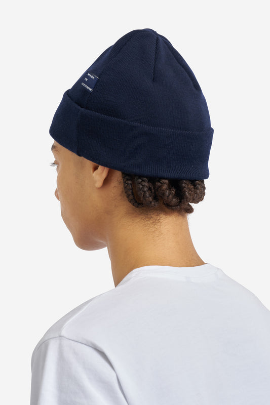 Unisex accessories beanie, 100% merino wool, navy, with "Made in Germany" label.