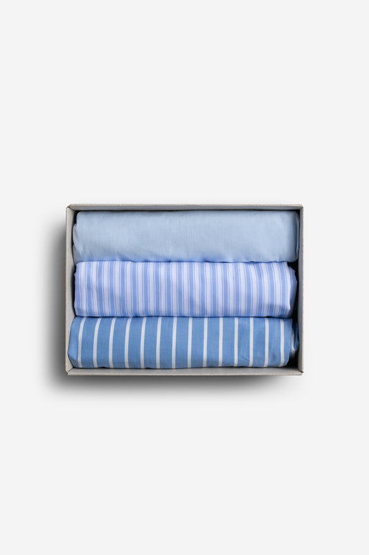 Men's jersey boxershorts, 100% organic cotton, light blue, blue striped, and blue and white striped, folded in a box.