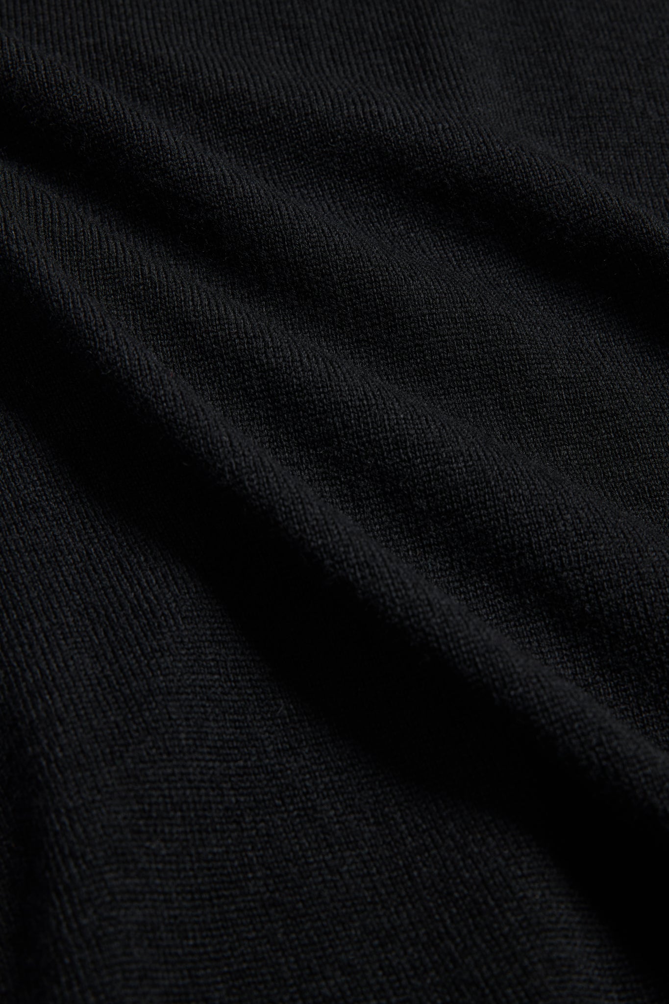 Unisex knit crewneck, finely knitted black mulesing-free merino wool with rib-knit details.