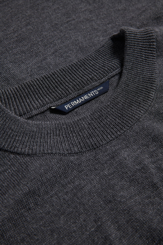 Unisex knit crewneck, dark-grey mulesing-free merino wool, with rib-knit neck, cuffs, and hem.